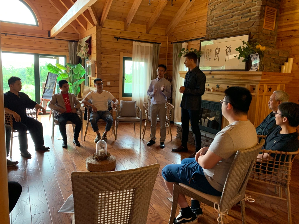 Parent participating in a sharing circle, promoting family